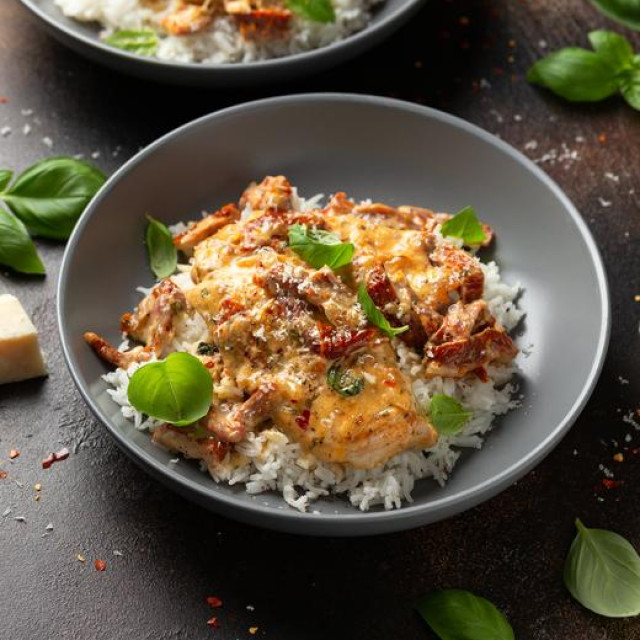 Marry Me Chicken. Creamy Garlic Sun Dried Tomato Chicken with rice. Healthy food.