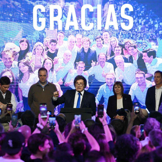 Argentina‘s President Javier Milei (C) speaks next to his advisor Santiago Caputo (L), the spokesperson for the Presidency Manuel Adorni (2nd-L), Minister of National Security and candidate for Senator Patricia Bullrich (3rd-R), Diego Santilli (2nd-R), and his sister, the General Secretary of the Presidency Karina Milei, at the ruling party‘s La Libertad Avanza headquarters following the results of the national midterm legislative election in Buenos Aires on October 26, 2025. Argentina‘s budget-slashing leader Javier Milei pulled off a stunning win in Sunday‘s midterm elections, boosting the flagging reform agenda of the US-backed right-winger. (Photo by Luis ROBAYO/AFP)