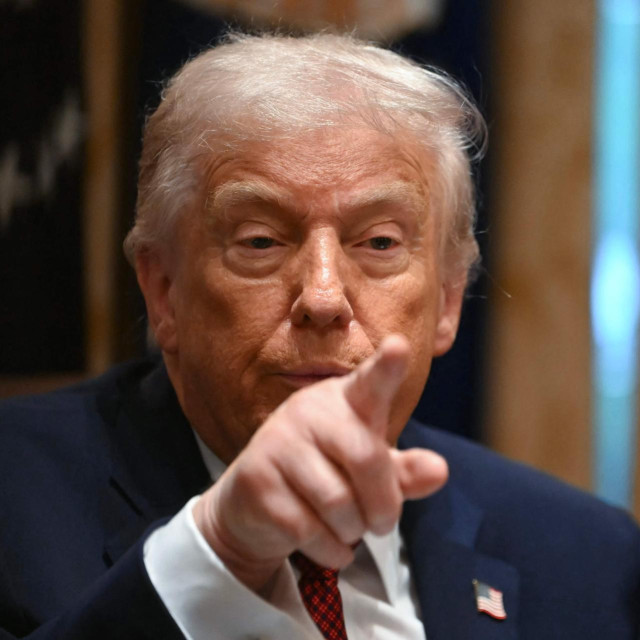 US President Donald Trump speaks during a roundtable event to discuss aid for farmers, in the Cabinet Room of the White House in Washington, DC, on December 8, 2025. President Trump is announcing a $12 billion aid package for US farmers, targeting a key support base hit by his trade policies. Since Trump‘s return to the White House in January, many US farmers have been battered by impacts of his wide-ranging tariffs, including retaliatory measures from trading partners. (Photo by ANDREW CABALLERO-REYNOLDS/AFP)