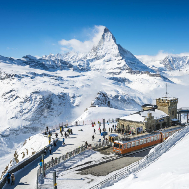 People at Gornergrat railway station (3.089 m) with Matterhorn peak above Zermatt town in Mattertal, Valais canton, Switzerland, in winter. Taken by Sony a7R II, 42 Mpix.