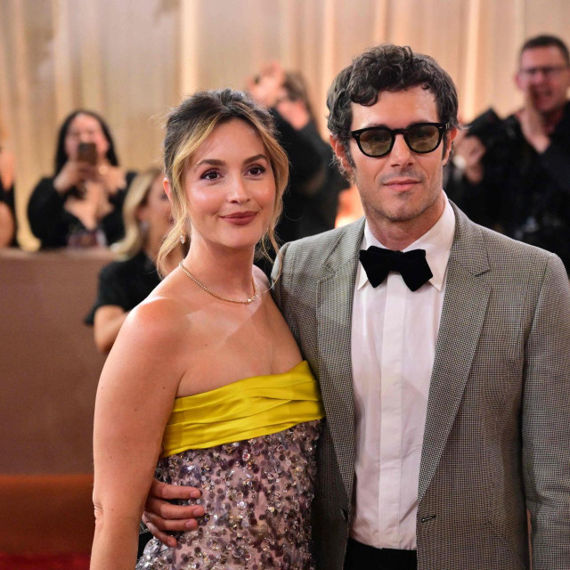 US actor Adam Brody and US actress Leighton Meester attend the 83rd annual Golden Globe Awards at the Beverly Hilton hotel in Beverly Hills, California, on January 11, 2026. (Photo by Frederic J. Brown/AFP)/-- IMAGE RESTRICTED TO EDITORIAL USE - STRICTLY NO COMMERCIAL USE --