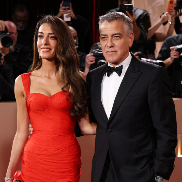 George Clooney and his wife Amal Clooney attend the 83rd annual Golden Globe Awards at the Beverly Hilton hotel in Beverly Hills, California, on January 11, 2026. (Photo by Michael Tran/AFP)/-- IMAGE RESTRICTED TO EDITORIAL USE - STRICTLY NO COMMERCIAL USE --