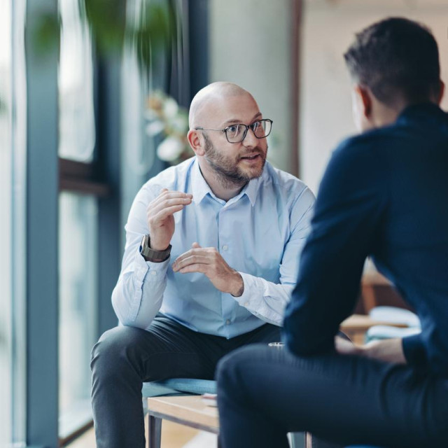 Two businessmen talking in the office