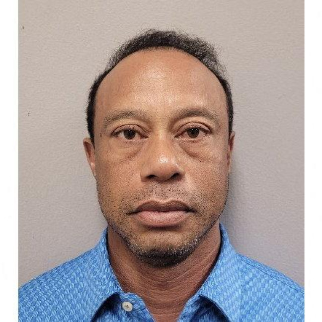 TOPSHOT - This handout mugshot released on March 27, 2026 provided by the Martin County Sheriff‘s Office shows the mugshot of US golfer Tiger Woods, 50, who was arrested in Jupiter Island, Florida on March 27, 2026. The golf icon was arrested and charged with driving under the influence after a rollover crash near his Florida home, authorities said. (Photo by HANDOUT/Florida Department of Corrections/AFP)/RESTRICTED TO EDITORIAL USE - MANDATORY CREDIT ”AFP PHOTO/Martin County Sheriff‘s Office” - HANDOUT - NO MARKETING NO ADVERTISING CAMPAIGNS - DISTRIBUTED AS A SERVICE TO CLIENTS