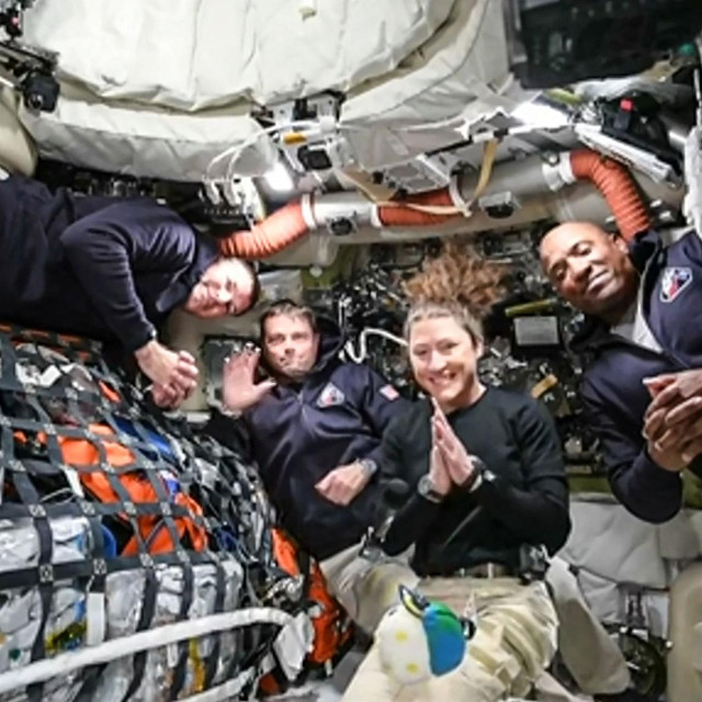 TOPSHOT - This screen grab from NASA‘s feed released on April 3, 2026, shows the four Artemis II crew members (L-R) Canadian Space Agency (CSA) astronaut Jeremy Hansen, Artemis II mission specialist, NASA astronauts Reid Wiseman, Artemis II commander, Christina Koch, Artemis II mission specialist and Victor Glover, Artemis II pilot as they head to orbit the Moon for the first time in more than half a century. The spacecraft lifted off from Kennedy Space Center in Florida at 18:35 EDT the previous day. (Photo by Handout/NASA TV/AFP)/RESTRICTED TO EDITORIAL USE - MANDATORY CREDIT ”AFP PHOTO/NASA” - HANDOUT - NO MARKETING NO ADVERTISING CAMPAIGNS - DISTRIBUTED AS A SERVICE TO CLIENTS