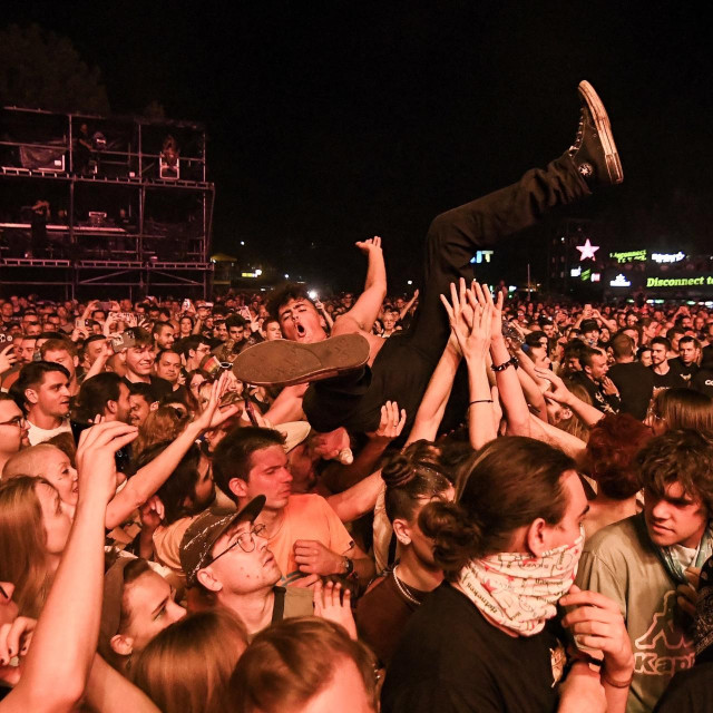 Festival-goers react during a concert at the Serbia‘s largest music festival ”EXIT”, in Novi Sad, on July 14, 2025. The curtain could fall on Serbia‘s biggest festival, held for 25 years in Novi Sad, ”EXIT”, a symbol of resistance to Slobodan Milosevic‘s regime and the fight against corruption in the country. Now, due to ongoing protests, public funding has suddenly disappeared, they say, and their partners have been ”forced to withdraw” under pressure.,Image: 1022925477, License: Rights-managed, Restrictions: TO GO WITH AFP STORY BY Mina PEJAKOVIC and Andrew LEESON, Model Release: no, Credit line: Nenad MIHAJLOVIC/AFP/Profimedia