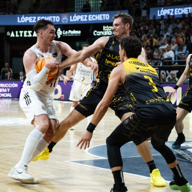 CANARY ISLANDS, SPAIN - JUNE 4: Mario Amosov of Real Madrid in action against Jaime Fernandez of La Laguna Tenerife during Liga ENDESA Playoff match between Real Madrid and La Laguna Tenerife at Santiago Martin in San Cristobal de la Laguna, Canary Islands, Spain on June 04, 2026. Andres Gutierrez/Anadolu (Photo by ANDRES GUTIERREZ/Anadolu via AFP)