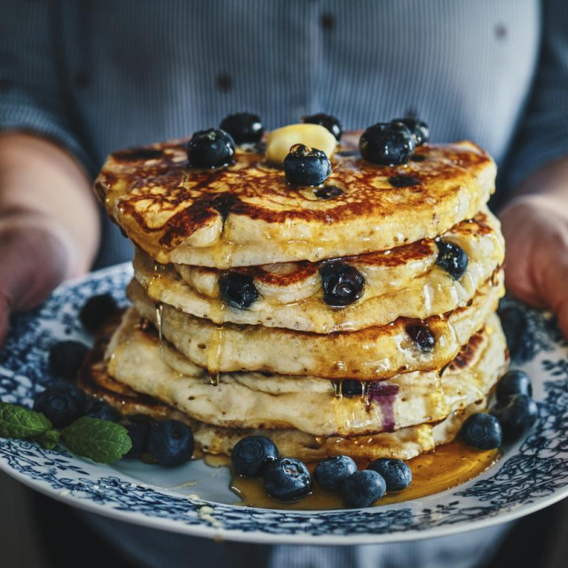 Stack of Pancakes with Maple Syrup and Fresh Blueberries