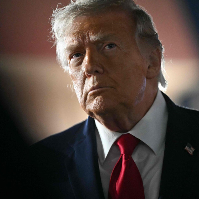 US President Donald Trump speaks to the press before boarding Air Force One prior to departure from John F. Kennedy International Airport, in New York, on June 8, 2026. Trump is returning to the White House after attending Game Three of the NBA Finals. (Photo by SAUL LOEB/AFP)