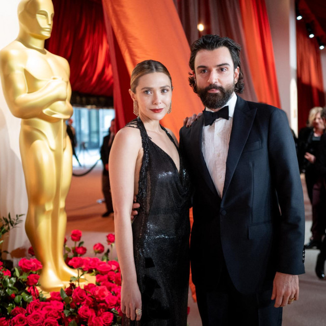 HOLLYWOOD, CALIFORNIA - MARCH 12: (L-R) Elizabeth Olsen and Robbie Arnett attend the 95th Annual Academy Awards at Hollywood & Highland on March 12, 2023 in Hollywood, California. Emma McIntyre,Image: 762374327, License: Rights-managed, Restrictions:, Model Release: no, Credit line: Emma McIntyre/Getty images/Profimedia