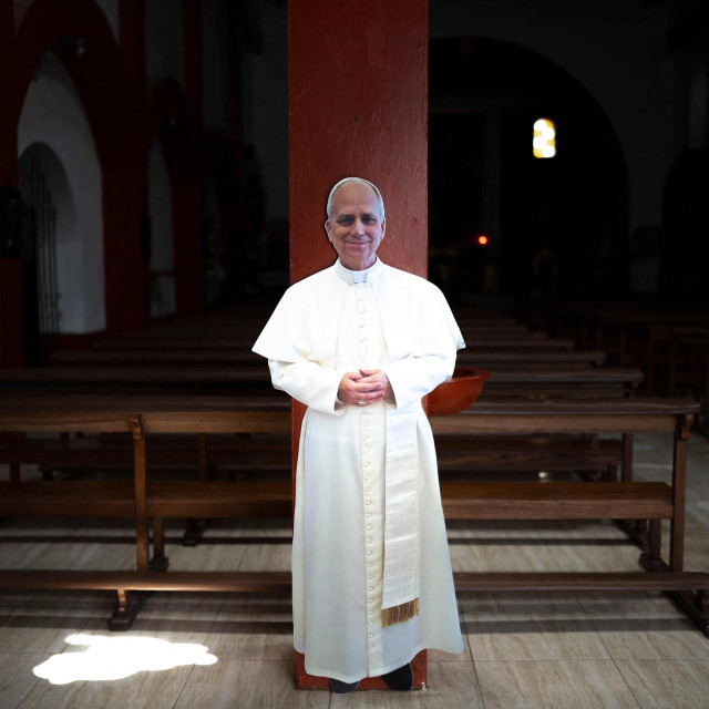 TOPSHOT - A cardboard cutout of Pope Leo XIV is displayed inside the main church in Sańa, in the Lambayeque region of northern Peru, on October 13, 2026. Pope Leo XIV had a cancerous tumor surgically removed from his right lung on October 13, in a 90-minute operation described as ”successful” by the Vatican. (Photo by Ernesto BENAVIDES/AFP)
